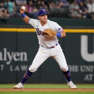 Josh Jung #6 of the Texas Rangers throws to first base during the fifth inning against the Boston Red Sox at Globe Life Field
