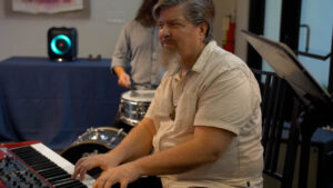 Timothy Girardot plays the keys with his band at the ABCTX 20 year celebration