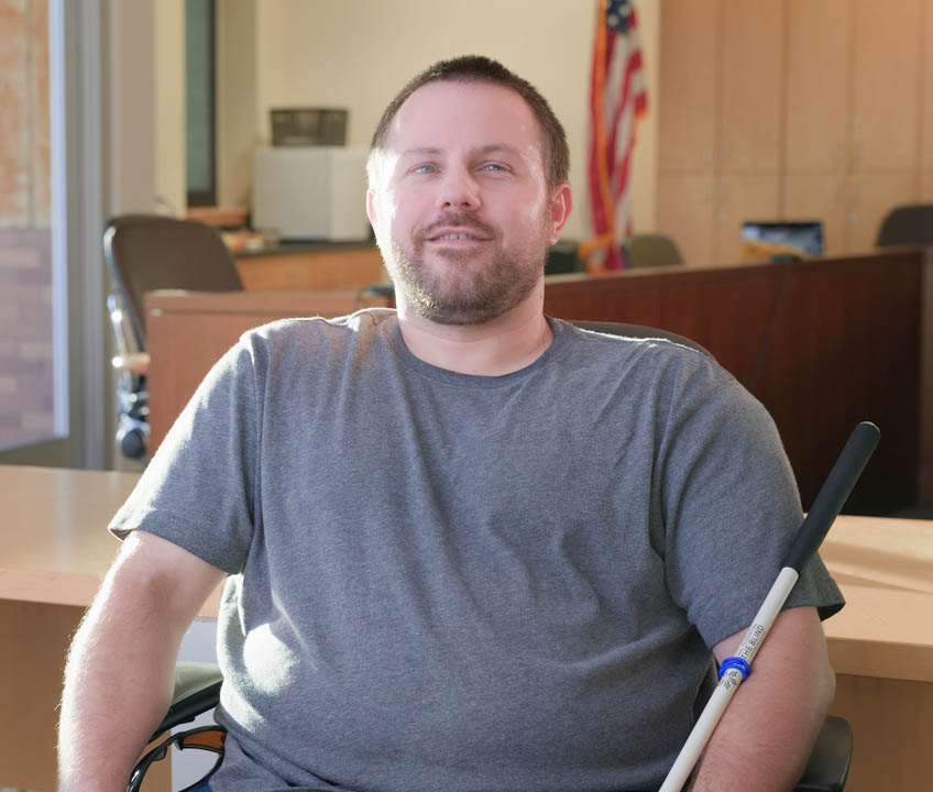 ABCTX Board - Andrew Bernet A photo of Andrew Bernet, seated in a board room.